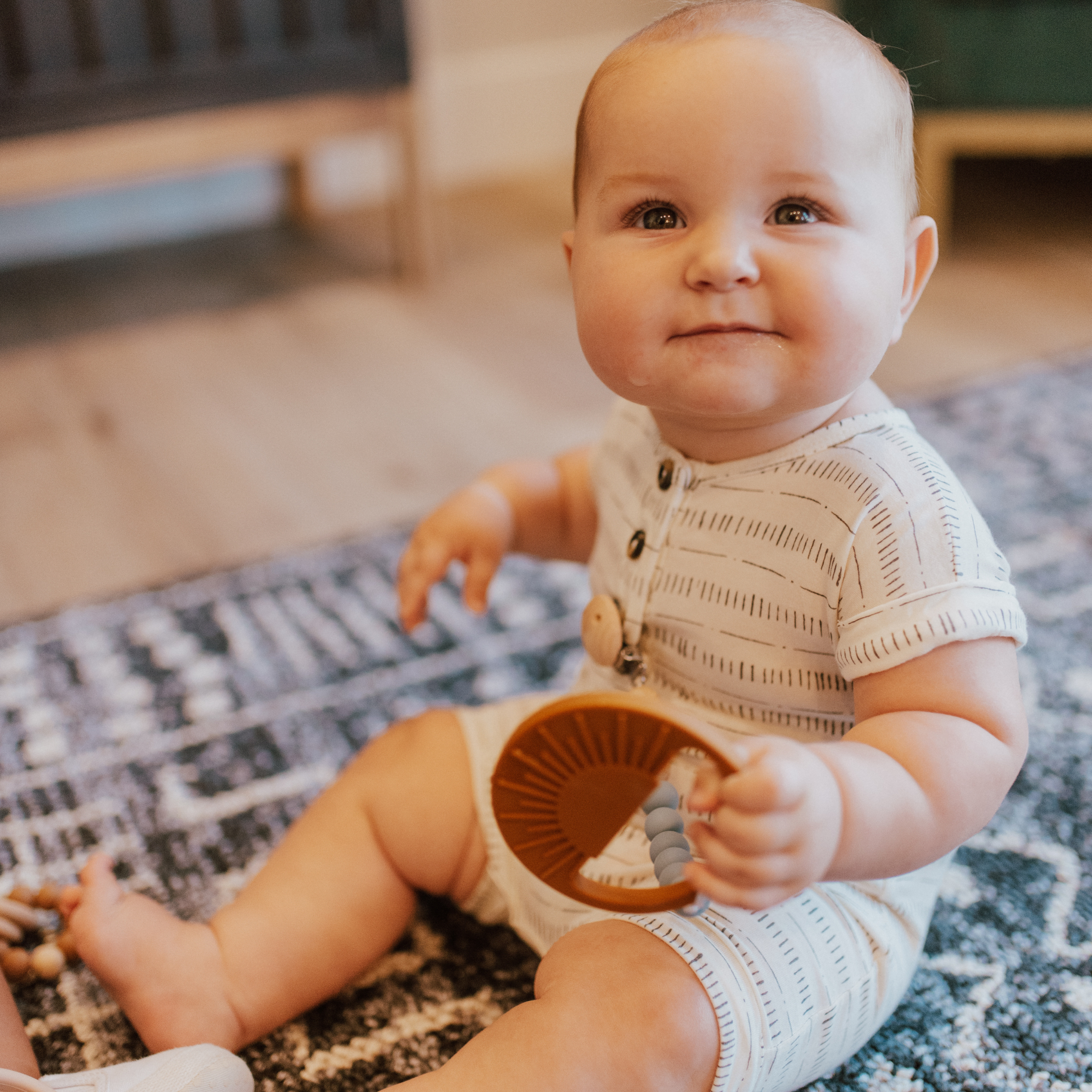 Light Rose Sunburst Teething Toy