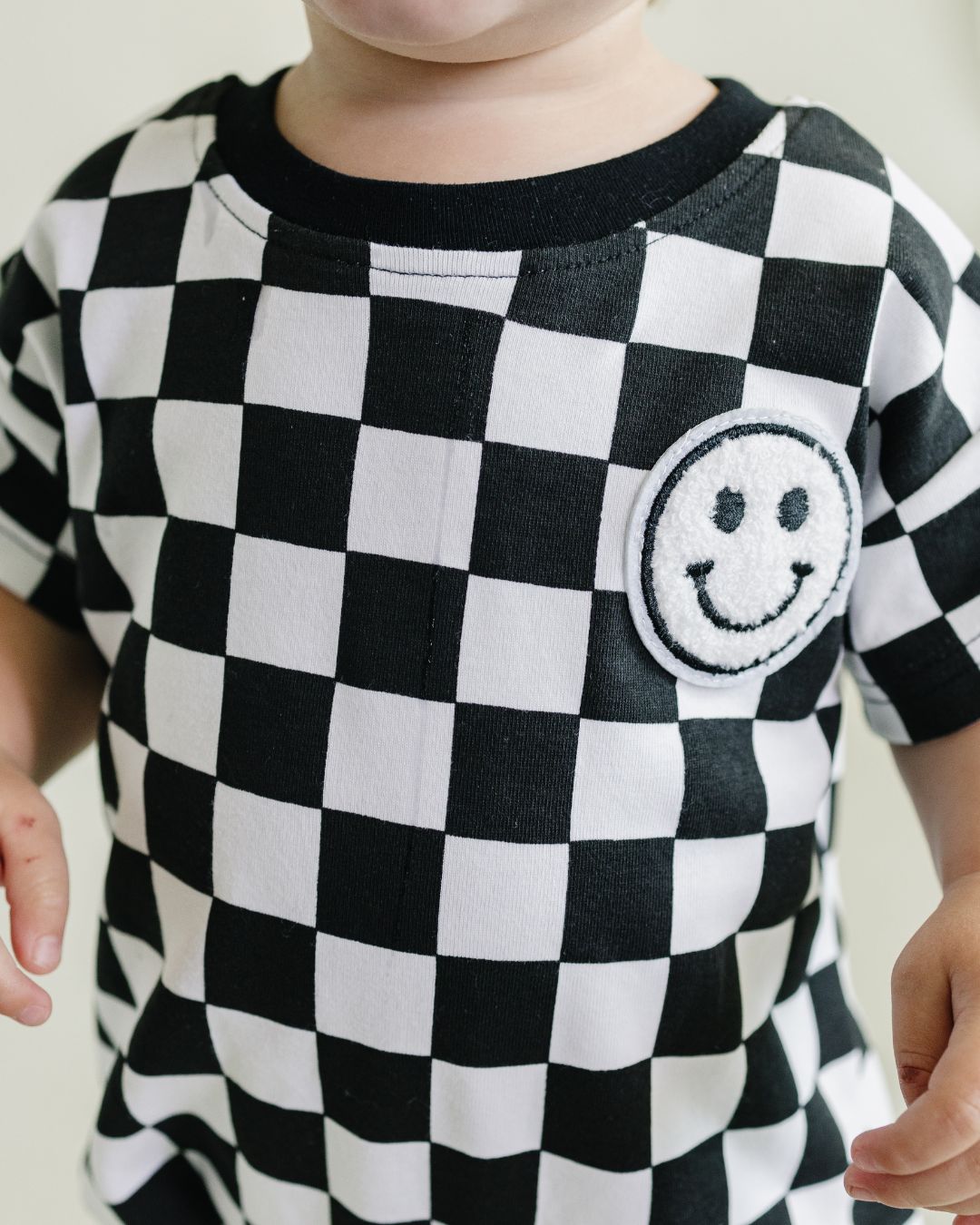 Short Sleeve Bubble Romper | Checkered Smiley Black