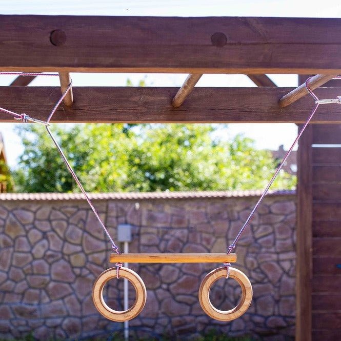 Trapeze swing bar with rings